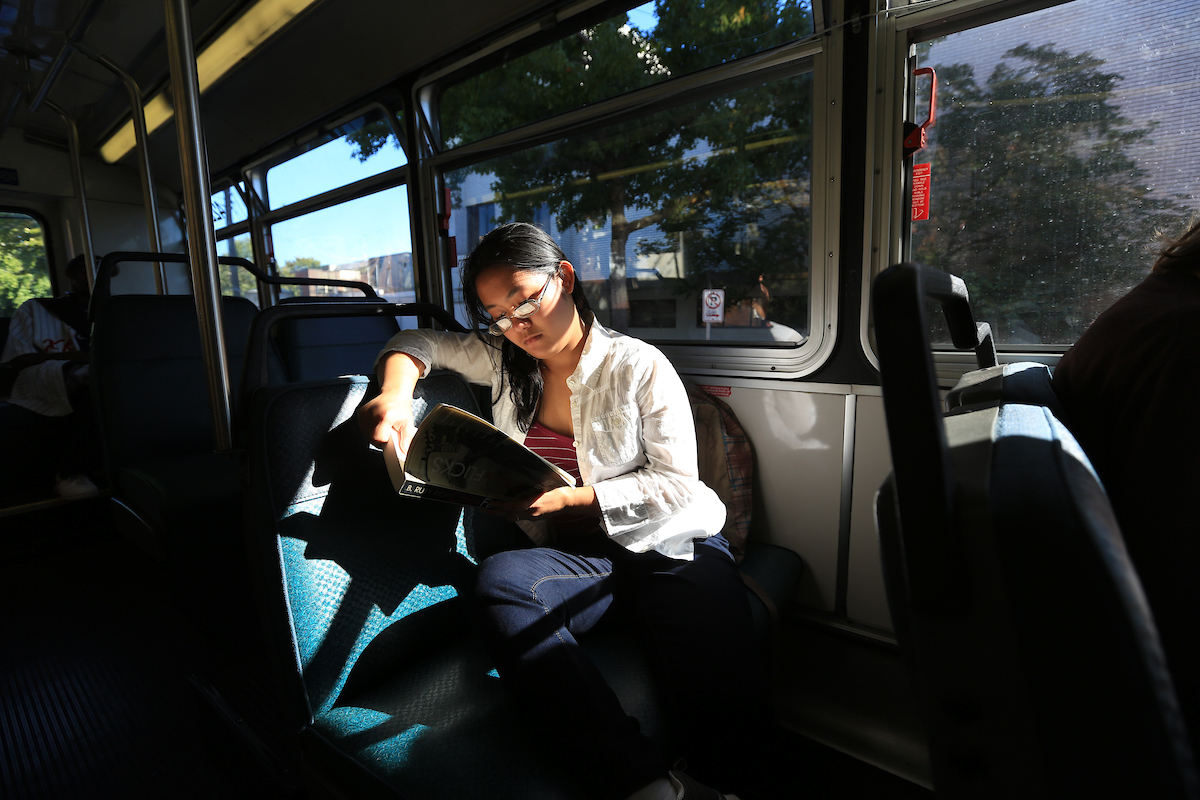 Senior film studies student Queenelle Gazmen taking a Metro bus on Capitol Hill